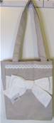 Sac tissu beige gros noeud blanc